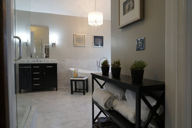 Bathroom - mid-sized transitional master white tile and porcelain tile porcelain tile and white floor bathroom idea in Atlanta with furniture-like cabinets, dark wood cabinets, a one-piece toilet, gray walls, an undermount sink, marble countertops and a hinged shower door