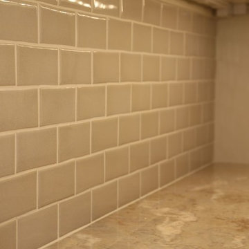Shiny ceramic subway tile backsplash