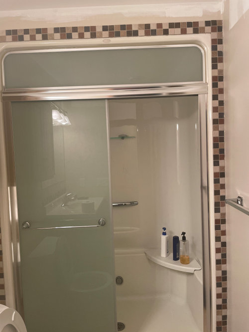 Removing tile from fiberglass shower surround