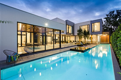 Photo of a large modern backyard rectangular lap pool in Melbourne.