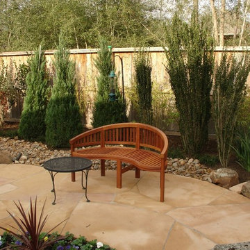 Landscaping with oversize pavers and backyard creek - hkns