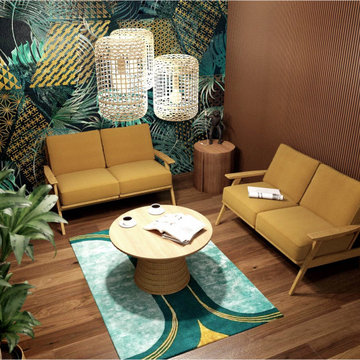 Fauteuils jaune, papier peint jungle et tapis graphique et suspensions en rotins