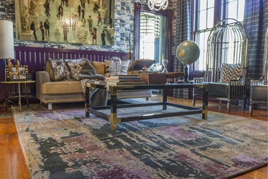 Mid-sized eclectic formal and enclosed medium tone wood floor living room photo in Boston with purple walls and no fireplace
