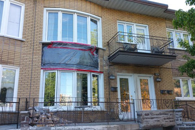 Example of an exterior home design in Montreal