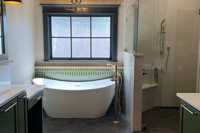 Inspiration for a large transitional master black floor and double-sink bathroom remodel in Oklahoma City with green cabinets, an undermount sink, quartz countertops, a hinged shower door and white countertops
