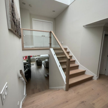 Slanted Glass panels with side brackets and square shape consistent wood post an