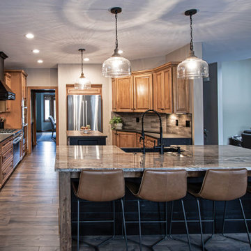 Reconfigured kitchen with new islands, countertops, backsplash