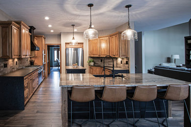 Reconfigured kitchen with new islands, countertops, backsplash