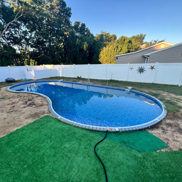Unilock XL smooth Almond Grove Pool Patio with Travertine Waterfalls - Deer Park