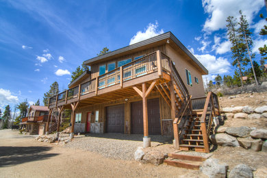 Rustic multicolored stucco exterior home idea in Denver