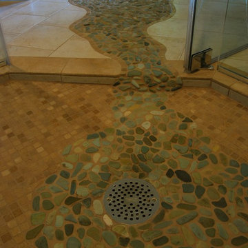 Flowing river rock bathroom