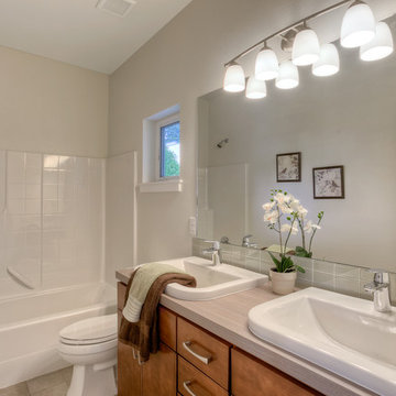 White Contemporary Bathroom with Tiled Tub and His and Hers Sinks