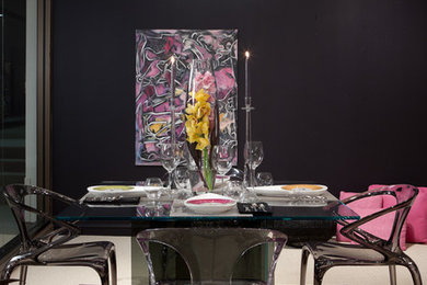 Example of a trendy carpeted dining room design in Detroit with black walls and no fireplace