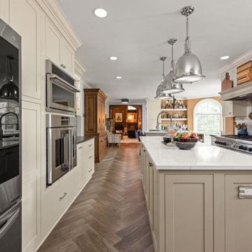 Warm Traditional Kitchen Remodel with Cream Cabinets & Herringbone Floors