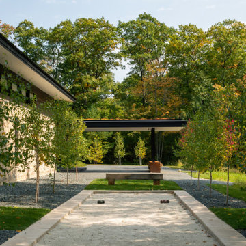 Modern Northwoods Residence Arrival Exterior & Bocce Court