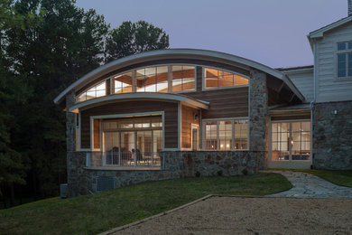 Pool house - large transitional indoor stone and rectangular pool house idea in DC Metro