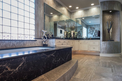 Bathroom - modern gray tile and glass sheet ceramic tile bathroom idea in Houston with recessed-panel cabinets, white cabinets, an undermount tub, gray walls and quartz countertops