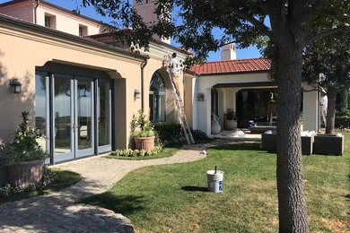 Example of a tuscan home design design in Orange County