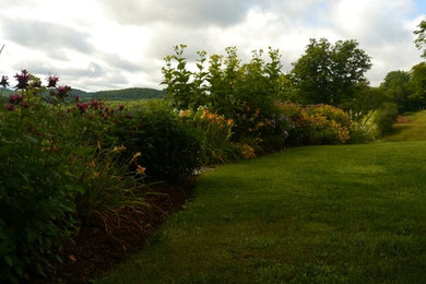 Design ideas for a farmhouse backyard formal garden in Burlington.