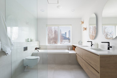Bathroom - large scandinavian master white tile and mosaic tile porcelain tile, gray floor and double-sink bathroom idea in Toronto with flat-panel cabinets, medium tone wood cabinets, a wall-mount toilet, white walls, an undermount sink, quartzite countertops, white countertops, a floating vanity and a niche