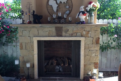 Photo of a transitional backyard stone landscaping in Los Angeles with a fire pit.