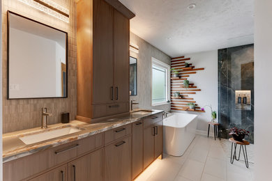 Large transitional master double-sink bathroom photo in Nashville with light wood cabinets, quartzite countertops and a built-in vanity