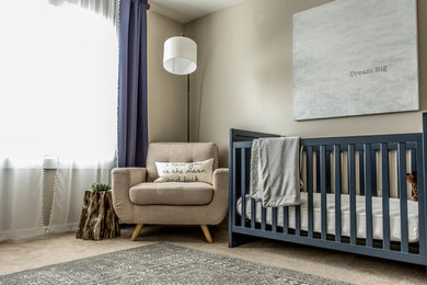 Mid-sized trendy boy nursery photo in Charlotte with beige walls