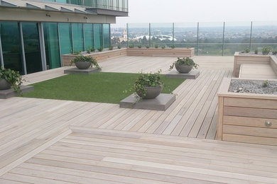 Photo of a large beach style rooftop deck in Melbourne with no cover.