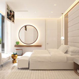 Design ideas for a large modern master bedroom in Miami with beige walls, marble floors and white floor.
