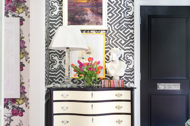 Inspiration for a timeless porcelain tile double front door remodel in Little Rock with a black front door