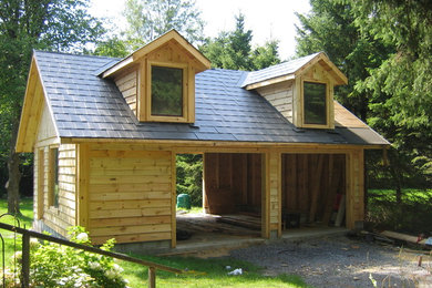 Mid-sized arts and crafts detached two-car garage photo in Ottawa