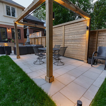 Modern Cedar Pergola, Porcelain Patio & Outdoor Lighting Backyard Renovation