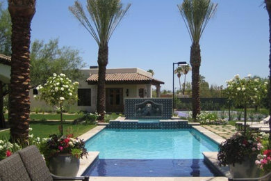Hot tub - mid-sized transitional backyard stone and rectangular lap hot tub idea in Phoenix
