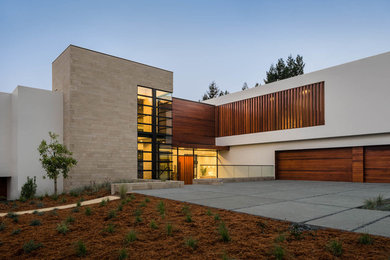 Contemporary two-storey white house exterior in San Francisco with mixed siding and a flat roof.