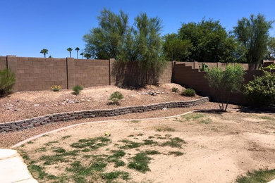 Photo of a mid-sized southwestern full sun backyard landscaping in Other.