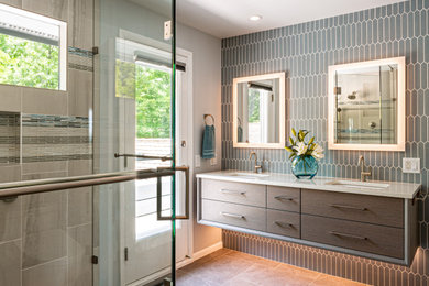 Inspiration for a large modern master blue tile and porcelain tile porcelain tile, gray floor and double-sink corner shower remodel in Chicago with gray cabinets, blue walls, an undermount sink, quartz countertops, a hinged shower door, white countertops and a floating vanity