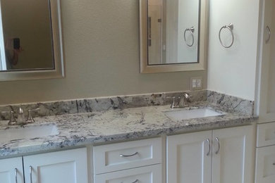 Doorless shower - modern beige tile and ceramic tile ceramic tile and beige floor doorless shower idea in Houston with flat-panel cabinets, white cabinets, granite countertops, a hinged shower door and gray countertops