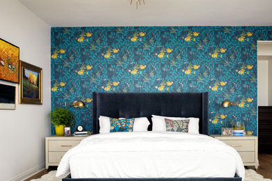 Contemporary master bedroom in San Diego with blue walls, medium hardwood floors and brown floor.