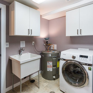 Small contemporary galley separated utility room in Portland with an utility sink, flat-panel cabinets, white cabinets, purple walls, ceramic flooring, a side by side washer and dryer and beige floors.