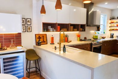 Example of a mid-century modern kitchen design in Other