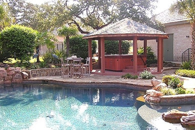 Deck - mid-sized traditional backyard deck idea in Austin with a pergola