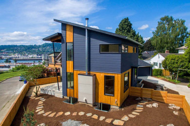 Mid-sized modern multicolored two-story mixed siding house exterior idea in Portland with a shed roof