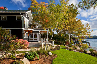 Example of a mid-sized arts and crafts two-story mixed siding exterior home design