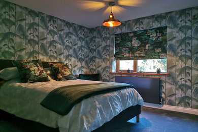 Design ideas for a small modern bedroom in Other with green walls, carpet and wallpapered walls.