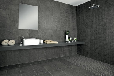 Example of a minimalist master black tile and slate tile ceramic tile walk-in shower design in New York with black walls and a vessel sink