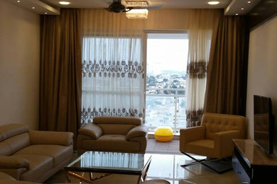 Example of a trendy living room design in Bengaluru