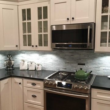 Shaker Style White Kitchen with Mullioned Glass Door Cabinets and Built-In Desk