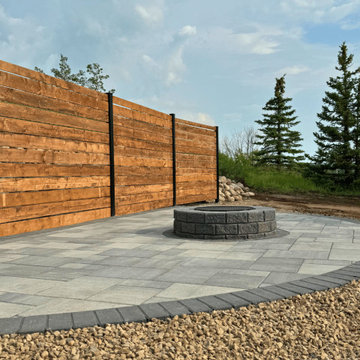 Cozy Backyard Fireplace with Elegant Wood Fence