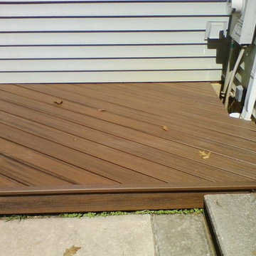 Ground level deck with planters