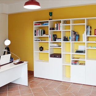 Photo of a modern home office and library in Other.